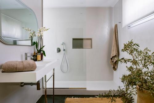 a bathroom with a shower and a sink at Villa 10 9 in Sant Josep