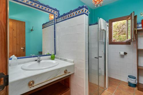 a bathroom with a sink and a shower at Group Villa 14 Pool Beach 10 minute in Frigiliana
