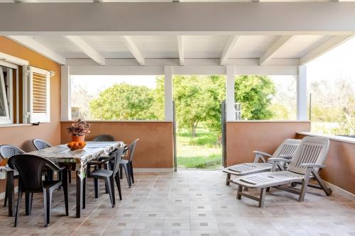 a dining room with a table and chairs at Ruralholidays in Calimera