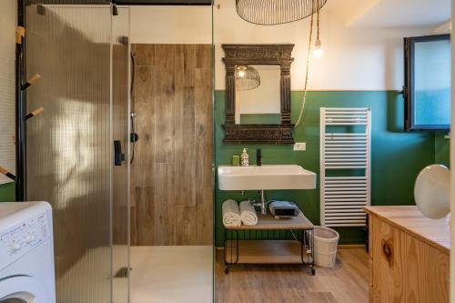a bathroom with a sink and a shower at Villa Torto with private pool in Monopoli
