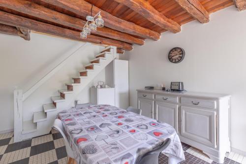 a bedroom with a bed and a staircase at maison Amboise in Limeray