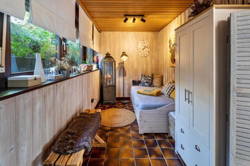 a living room with a couch and a table at Auszeyt Edersee für Vier in Waldeck