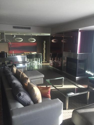 a living room with a couch and a table at Stunning 1 bedroom suite in Las Vegas