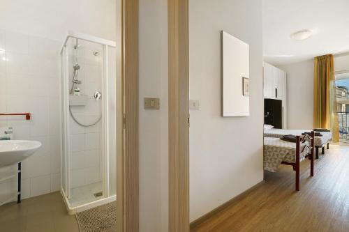 a bathroom with a shower and a sink in a room at Villa Trentina in Lido di Jesolo