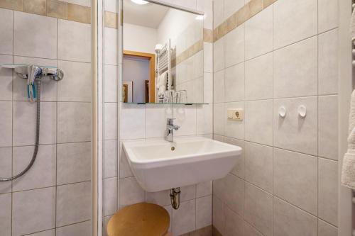 a bathroom with a sink and a shower at Ferienwohnung Ufert in Meißen