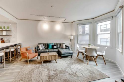 a living room with a couch and a table at 3BR recently renovated SOMA flat in San Francisco