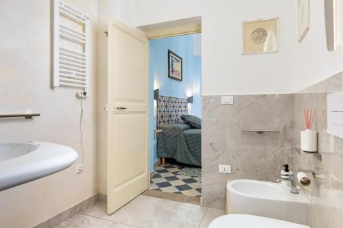 a bathroom with a sink and a toilet in a room at Donna Cesarina - Maison de Charme in Maruggio