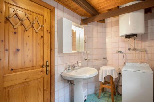 a bathroom with a sink and a toilet at Piccolo Paradiso in Cogne