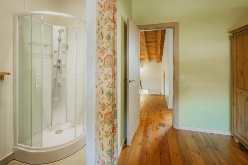 a bathroom with a walk in shower and a glass shower stall at La Alameda in Marazuela