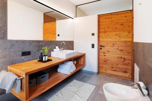 a bathroom with a sink and a mirror at Ansitz Röfen in Burgusio