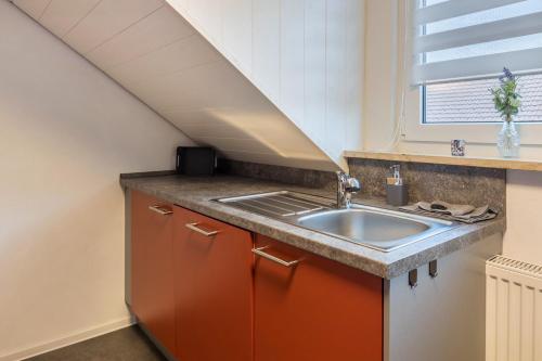 a kitchen with a sink and a window at am Salinensee in Bad Dürrheim