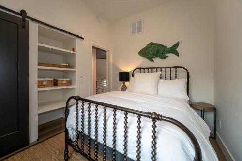 a bedroom with a bed with a fish on the wall at Hemlock Cottage · Hemlock Cottage in Pisgah Forest - Pet Friendl in Brevard