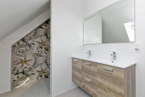 a bathroom with a sink and a mirror at Villa Ker Minet - Houat - 8 pers in Piriac-sur-Mer