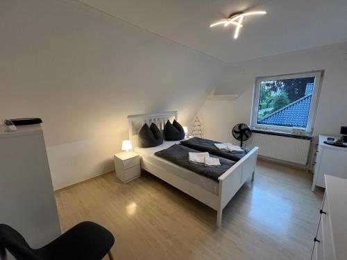 a bedroom with a bed and a window at Ferienhaus Almir in Haselünne