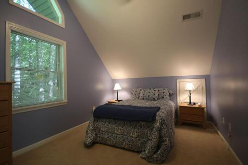 a bedroom with a bed and a window at White Squirrel`s Nest · White Squirrel`s Nest in Sherwood Forest in Rosman