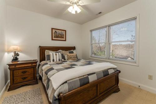 a bedroom with a bed and a window at Bearly Ruffin It · Bearly Ruffin It in Connestee Falls in Brevard
