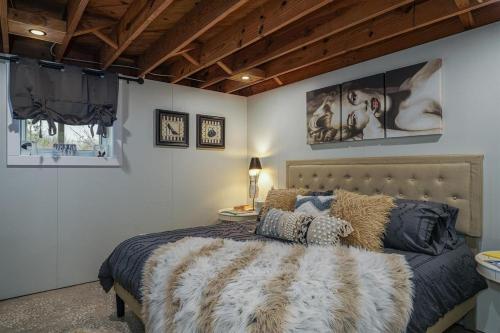 a bedroom with a large bed with a furrational sqor at JB`s Place · JB`s Place in Brevard