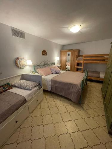 a bedroom with two beds in a room at Casa Fiore in Borgo Capanne