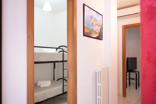 a room with a bunk bed and a mirror at Casa di Titina a Otranto in Otranto
