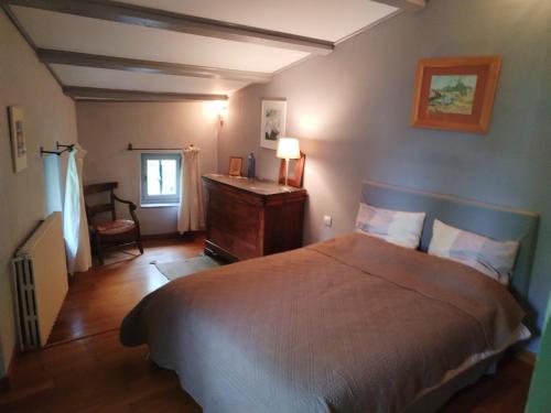 Llit o llits en una habitació de La Maison De Thomas