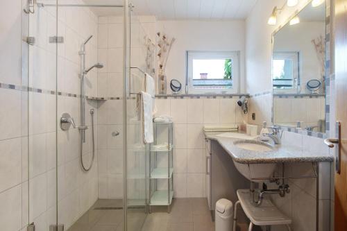 a bathroom with a shower and a sink at Ferienhaus am Blumengässle in Feldberg