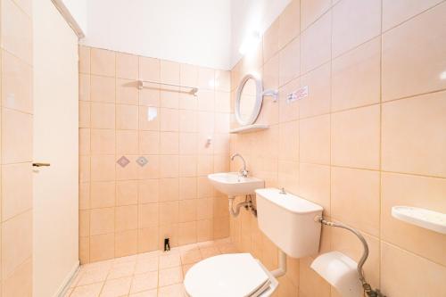 a bathroom with a toilet and a sink at Arianna apartment 14 in Paleokastritsa