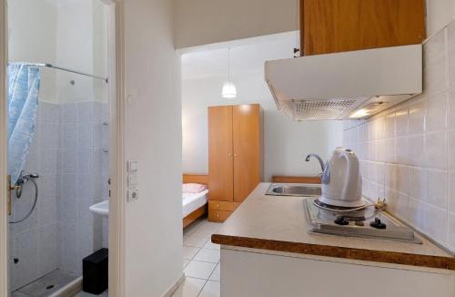 a kitchen with a mixer on top of a counter at S6 apartment in Nikiana
