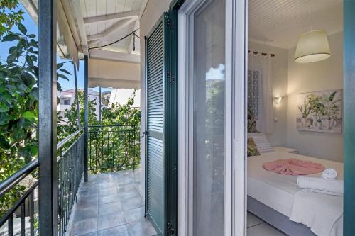 a room with a balcony with a bed at S6 apartment in Nikiana