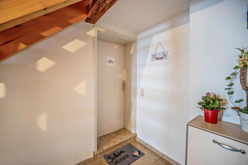 a hallway with a stairway leading up to a room at Fewo Gipfelstürmer mit Königscard in Nesselwang