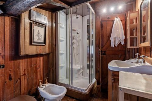 a bathroom with a shower and a sink and a toilet at Casa do Gerês in Geres