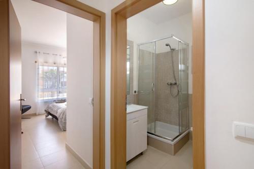 a bathroom with a shower and a sink at Royal Cabanas Golf 89 in Cabanas de Tavira