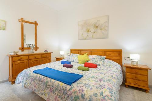 a bedroom with a bed with pillows on it at El Golfo Lanzarote in El Golfo