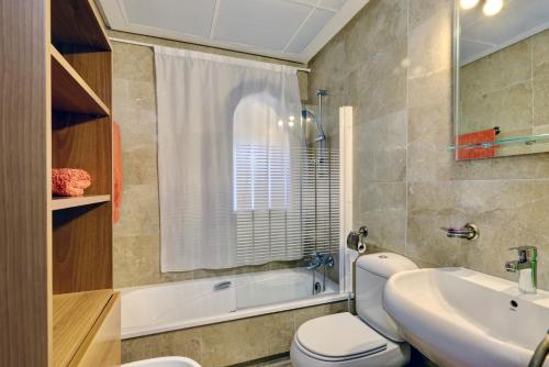 a bathroom with a toilet and a sink at Marina de la Duquesa 805 in Manilva