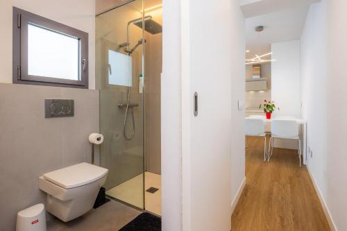 a bathroom with a shower and a toilet and a sink at Ca Na Tonina Ref 7000 in S'Illot