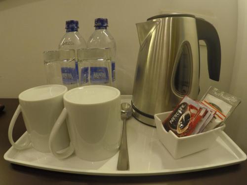a tray with two cups and two bottles of water at Venue Colombo in Colombo