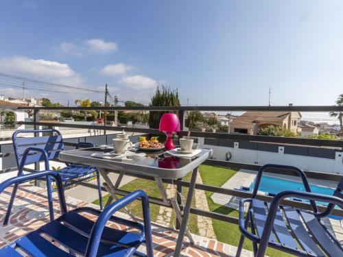 a table with a bowl of food on a balcony at Villa Mi Capricho by Interhome in Calafell