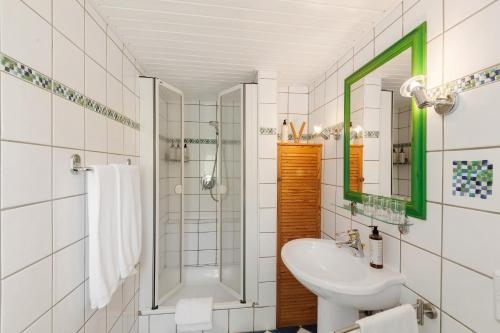 a bathroom with a sink and a shower at You R Welcome in Lauterbach