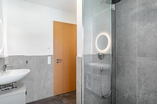 a bathroom with a sink and a shower at Beim Klarwein in Farchant