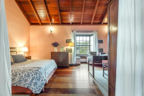 a bedroom with a bed and a desk at Gran Drago in Valverde