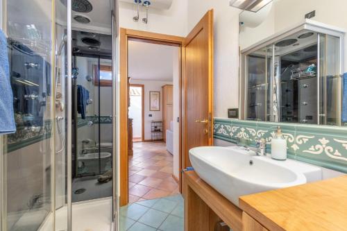 a bathroom with a sink and a shower at 4 Appartamento Cala Brandinchi in San Teodoro