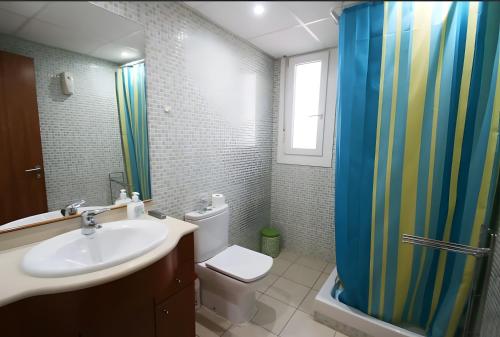 a bathroom with a sink and a toilet and a shower at Villa María Magdalena in Cambrils