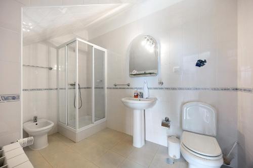 a bathroom with a shower toilet and a sink at Monte Lemos Villa 35 in Luz