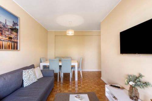 a living room with a couch and a table at Destiny Oporto in Maia