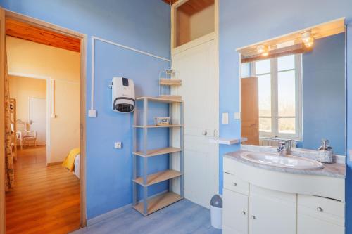 a bathroom with a sink and a window at Gîte Le Chant Des Oiseaux in Pradons
