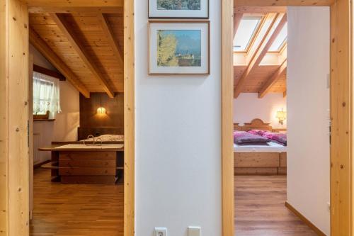 a hallway leading to a bedroom in a house at Funtnatsch Apartment Langkofel in Laion