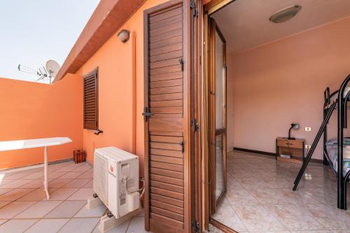 a room with a door and a room with a heater at Tara house in Pula