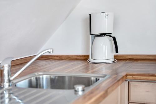 a coffeemaker sitting on top of a kitchen counter at Abendsonne in Koserow