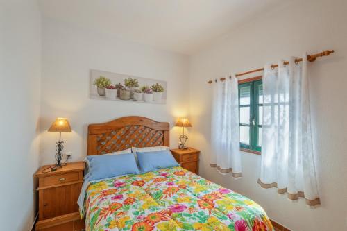 a bedroom with a bed and a window at Casa Isabel in Tijarafe