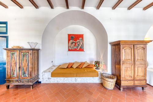 a bedroom with a bed and a dresser at Villa Blu La Cambusa in Castro di Lecce