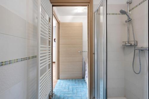 a bathroom with a walk in shower next to a walk in shower at La Vigna - Tra 5 terre e Versilia in Sarzana